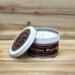 Pine and eucalyptus scented soy candle in 6oz tin with lid off.