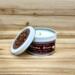 Lavender and rosemary scented soy candle in 6oz tin with lid off.