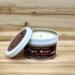 Maple, apple and cinnamon scented soy candle in 6oz tin with lid off.