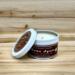 Fir tree scented soy candle in 6oz tin with lid off. 