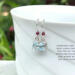 Blue topaz and garnet earrings in sterling silver by MariesGems.