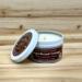Gingerbread scented soy candle in 6oz tin with lid off.