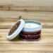 Lilac scented soy candle in 6oz tin with lid off.
