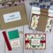 A handmade Christmas card kit with Christmas bulb paper, cardstock, embellishments, ribbons and envelopes to DIY 6 holiday greeting cards.