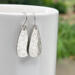 Hammered sterling silver teardrop dangle earrings by MariesGems.