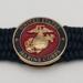 Very thin, flexible and comfortable black US Marine Corps bracelet featuring a 24K gold plated USMC Eagle Globe & Anchor and a Cobra buckle.