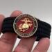 Very thin, flexible and comfortable black US Marine Corps bracelet featuring a 24K gold plated USMC Eagle Globe & Anchor and a Cobra buckle.