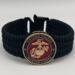 Very thin, flexible and comfortable black US Marine Corps bracelet featuring a 24K gold plated USMC Eagle Globe & Anchor and a Cobra buckle.