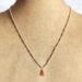 Delicate Carnelian Gemstone Copper Wire Wrapped Necklace Close up on Bust