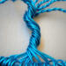 Blue wire is used to twist into trunk roots are secured with blue wire and trunk is formed by twisting and turning the wire
