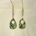 Abalone shell earrings, both front and back feature abalone with protective coating