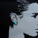 Silhouette of face wearing stud earring