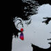 Face silhouette with purple to red blend triangle earrings
