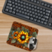 Mouse pad on rustic wooden desk with laptop
