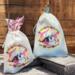 Burlap bag your ornament will come in (style and color may vary with season). Fantastic for gift giving and storage!