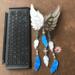 Little Angel Wind Chime by Robin C. Hary- shown next to iPad Pro keyboard for size reference.