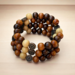wood bead wrap bracelet with a metal butterfly charm. This is very charming.