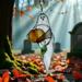 Ghost with Pumpkin stained glass suncatcher. Made of white and  orange glass with lamp worked glass leave accent.
