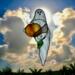 Ghost with Pumpkin stained glass suncatcher. Made of white and  orange glass with lamp worked glass leave accent.
