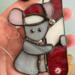 Christmas Mouse stained glass suncatcher. Made with gray, pink, white and red glass. Crystal eyes, nose and hat pom-pom.