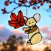 Mouse with leaf suncatcher made of light brown, light pink and red glass.