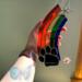 Rainbow Bridge Suncatcher- Black Paw- being held for size reference.