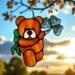 Saint Patrick's Day Bear suncatcher in direct sunlight- Brown