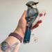 Blue Jay by Robin C. Hary- made with shades of blue, black, and white glass. Shown being held for size reference.