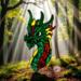 Dragon by Robin C. Hary made of red, green and yellow glass.