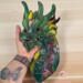 Dragon by Robin C. Hary being held for size reference.