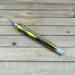 Black and yellow wood handled craft knife