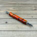Large ergonomic seam ripper in orange and black resin