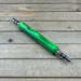 Eccentric green seam ripper 