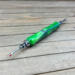 Bright lime green seam ripper with large ergonomic grip