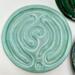 Seafoam Satin: 
Ceramic finger labyrinth in a soft aqua glaze, handmade as a tactile tool for meditation and stress relief. Interior photo. 