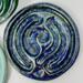 Blue Suede:
Royal blue ceramic finger labyrinth with metallic sparks, handmade for mindfulness and stress reduction. Interior photo. 