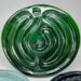 Crushed Velvet:
Deep green ceramic finger labyrinth with a metallic finish, crafted for meditation and calming touch. Interior photo. 