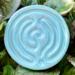 Seafoam Satin: 
Ceramic finger labyrinth in a soft aqua glaze, handmade as a tactile tool for meditation and stress relief. Outside photo. 