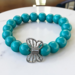 very pretty handmade glass turqoise blue glass bead bracelet.
