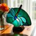 Dragonfly Stained Glass Fan Lamp by Robin C. Hary shown with white wings and green background.