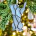 Ornaments by Robin C. Hary- gray- shown hanging on a Christmas tree.