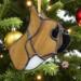 French Bulldog Stained Glass ornament made of tan colored glass, hanging from a Christmas tree with Christmas ornaments and lights around it.