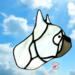 French Bulldog stained glass ornament made of light gray glass, hanging on a window in bright sunlight.