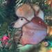 Poodle stained glass ornament shown in Apricot- close up hanging in a Christmas Tree.