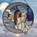 Angel on the Crescent Moon stained glass panel, a pale purple moon with purple blue sky and light blue/white clouds- the angel is dressed in a white dress, wings are made of iridescent and clear glass, her hair is rich brown color and falls to her waist. Skin color is fair.