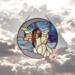 Angel on the Crescent Moon stained glass panel, a pale purple moon with purple blue sky and light blue/white clouds- the angel is dressed in a white dress, wings are made of iridescent and clear glass, her hair is rich brown color and falls to her waist. Skin color is fair.