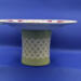 This shows the lattice work on the "stand". The faint white trim in the lattice matches the lace on the plate. This shows the lattice work on the "stand". The faint white trim in the lattice matches the lace on the plate.