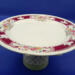 This decorative dish stand is ready to be used to serve goodies or hold your jewelry. It's 9 inches wide by 5 inches high. This decorative dish stand is ready to be used to serve goodies or hold your jewelry. It's 9 inches wide by 5 inches high.