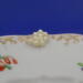 This is the closeup of the pearl flower. You can also see the gold trim around the saucer. This is the closeup of the pearl flower. You can also see the gold trim around the saucer.
