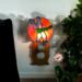 Dragonfly Stained Glass Night Light- in green and blue iridescent glass with yellow, orange mottle glass backdrop. Shown lite.